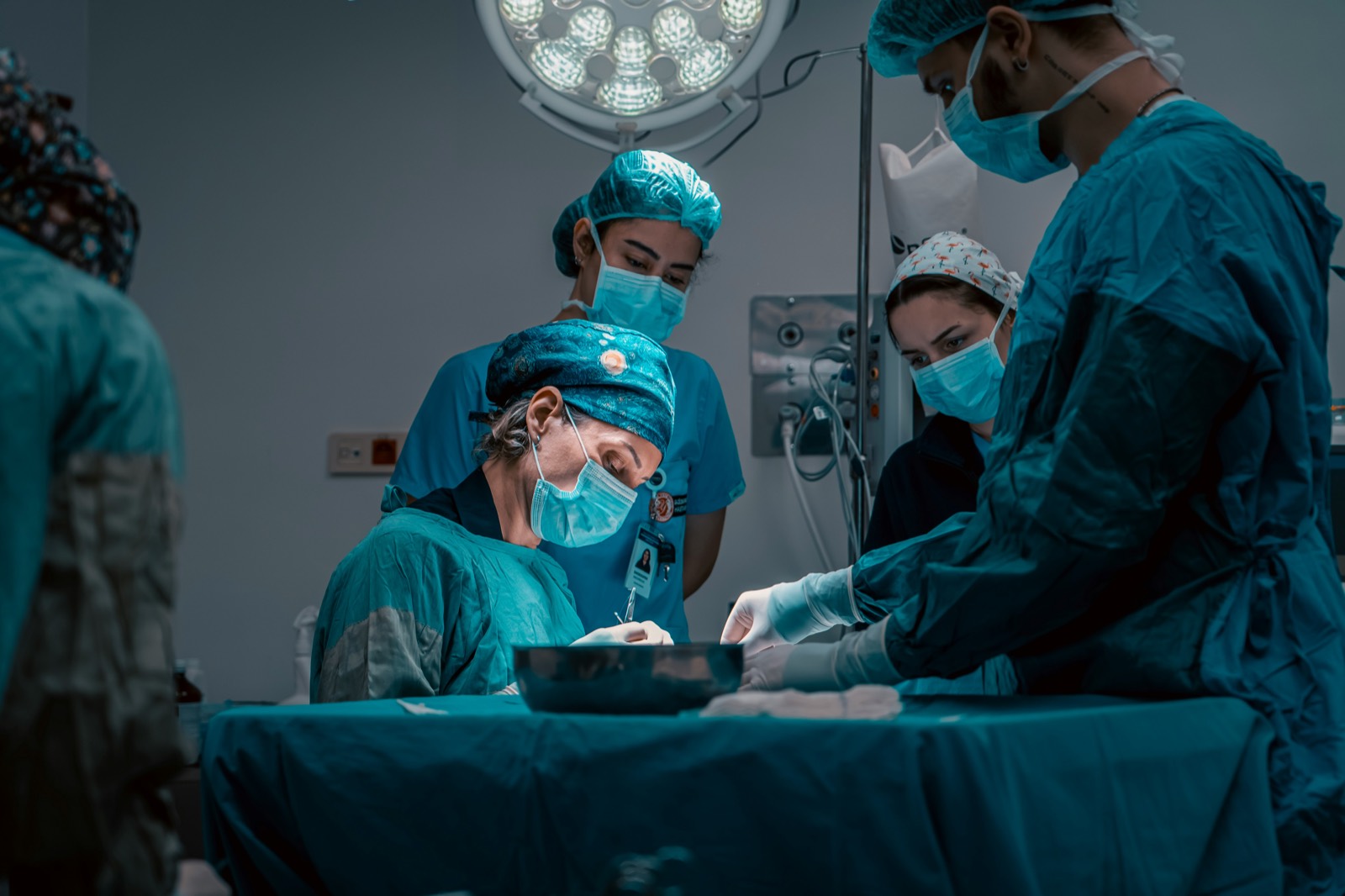 A surgical team operating in an operating room